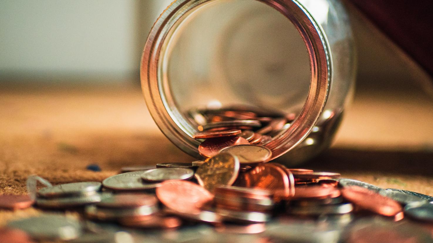 tipped over jar of coins