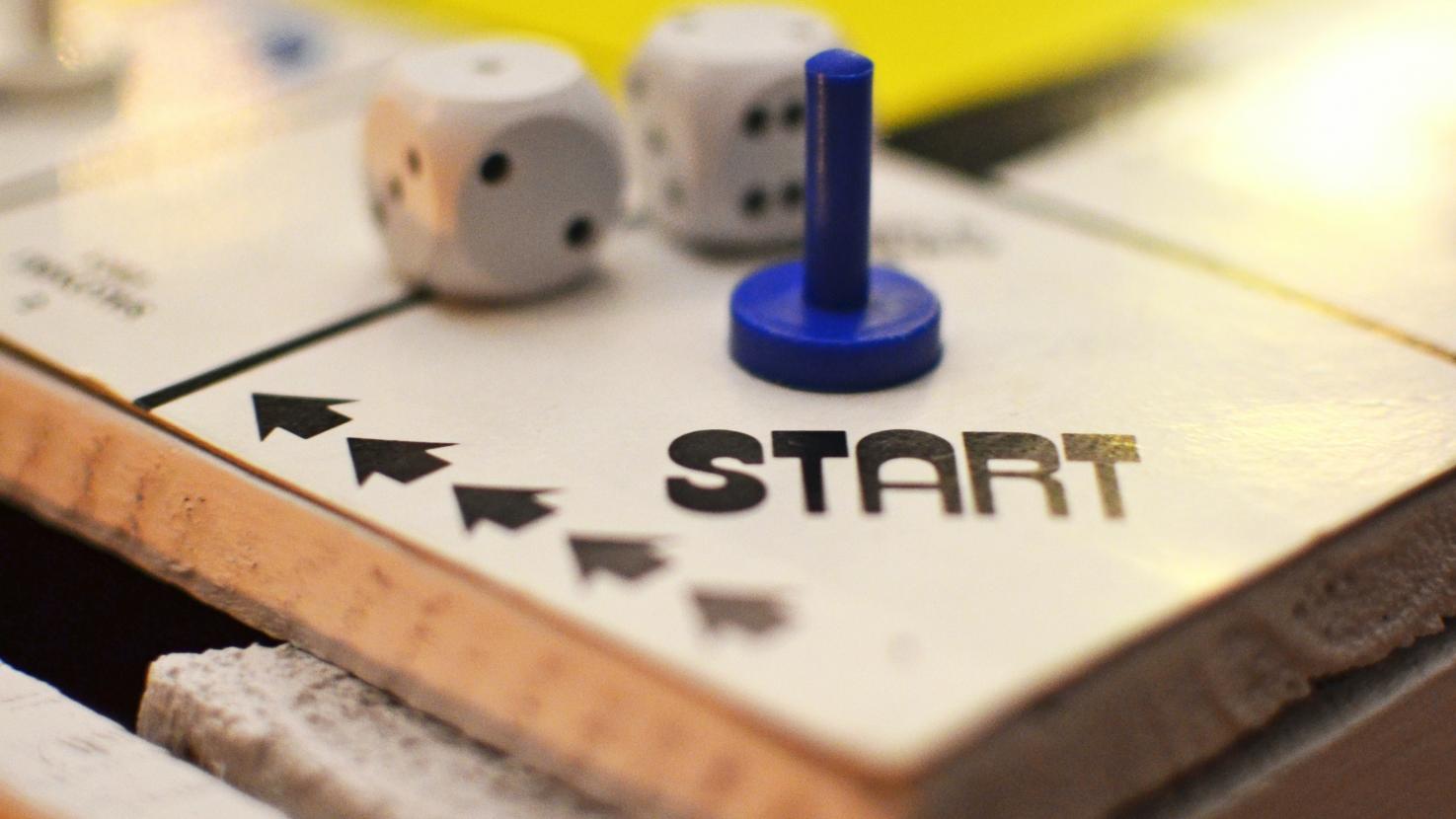 Game board with game piece on the start square