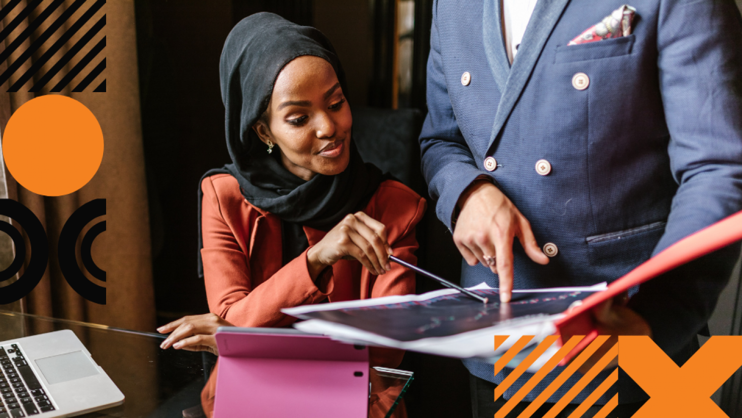 Woman reviewing data with another colleague