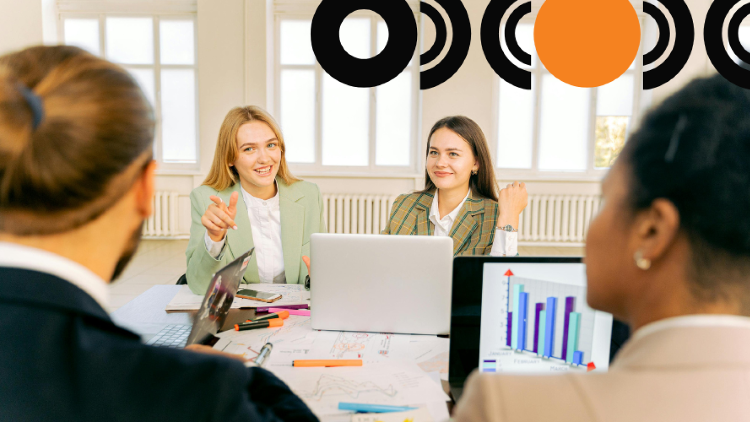 coworkers discussing data at a desk