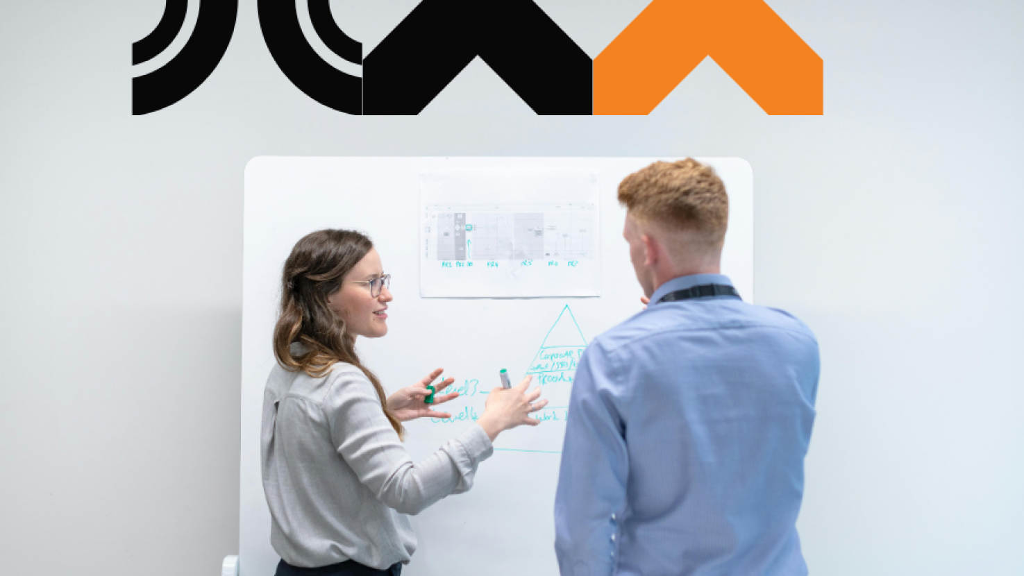 Two co-workers discussing data