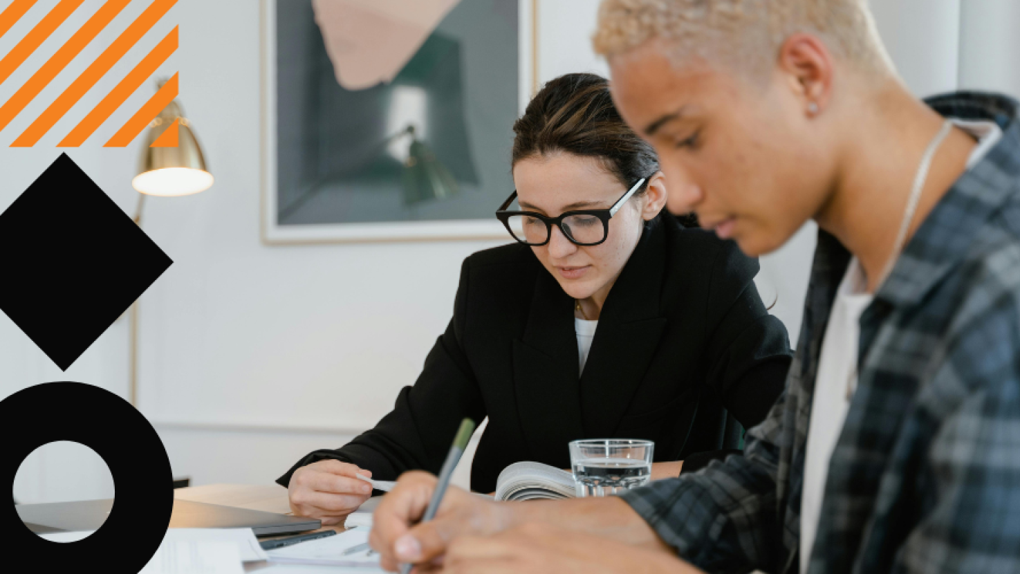 Two people working on a data project together
